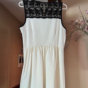 Lovely soft dress. Darling lace on top with a plain black band Lined. Worn once